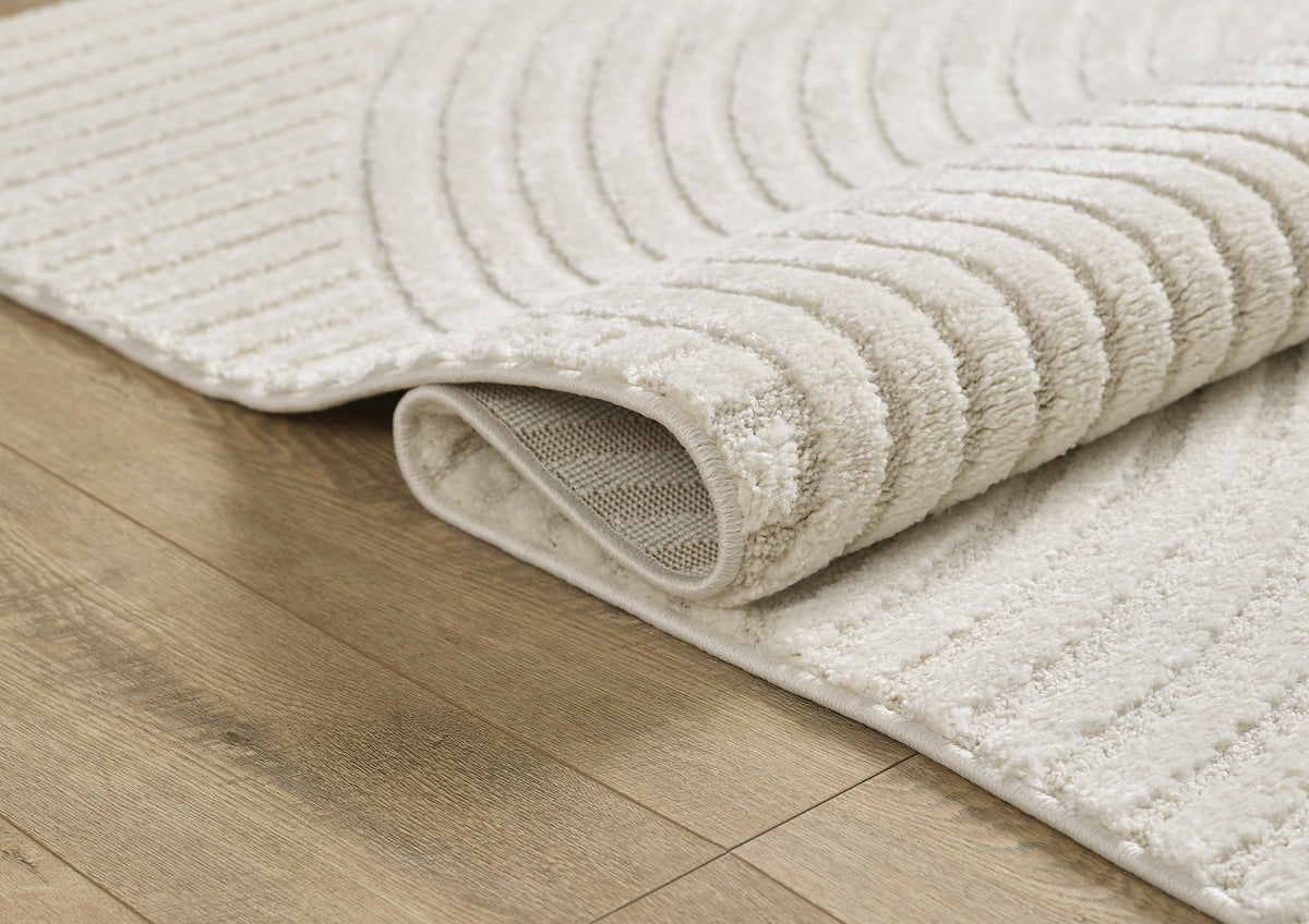 Vloerkleed Elio 2251 Crème – Laagpolig in acht maten tot 300x400 – opgerolde hoek met jute rugzijde
