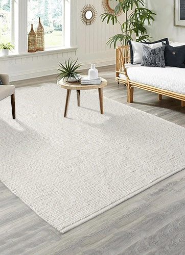 Vloerkleed Copenhagen Crème – Vlakgeweven Wol met Katoen – opgerolde hoek met zicht op de rugzijde