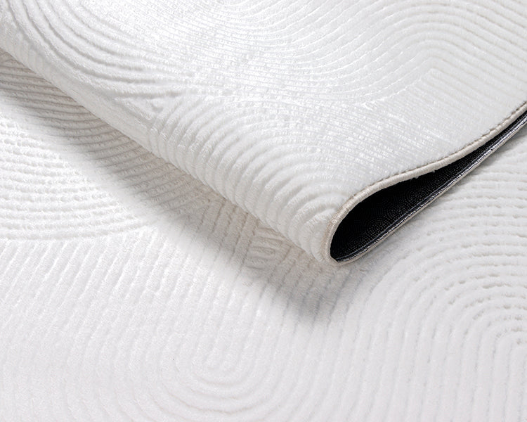 Vloerkleed Stilo 390 Gebroken Wit – Vlakke pool van 8 mm – hoek met de jute rugzijde zichtbaar