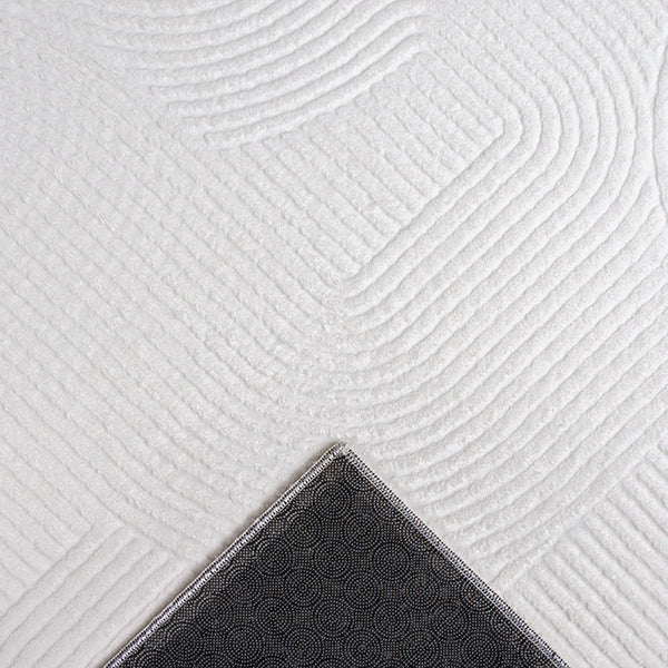 Vloerkleed Stilo 390 Gebroken Wit – Vlakke pool van 8 mm – sfeerimpressie in de slaapkamer