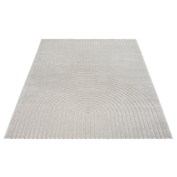 Vloerkleed Eclipse 2320 Grijs – Geweven cirkels, 12 mm pool – hoek van het kleed op een houten vloer