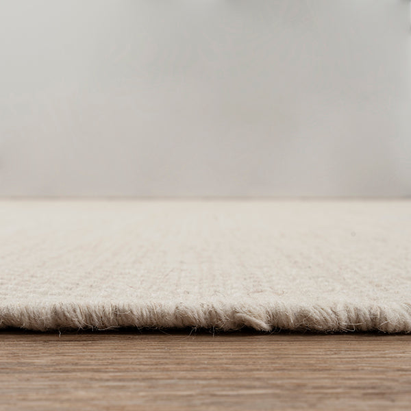 Vloerkleed Scandic Crème – Platgeweven wol met juterug – detail van het platte weefsel