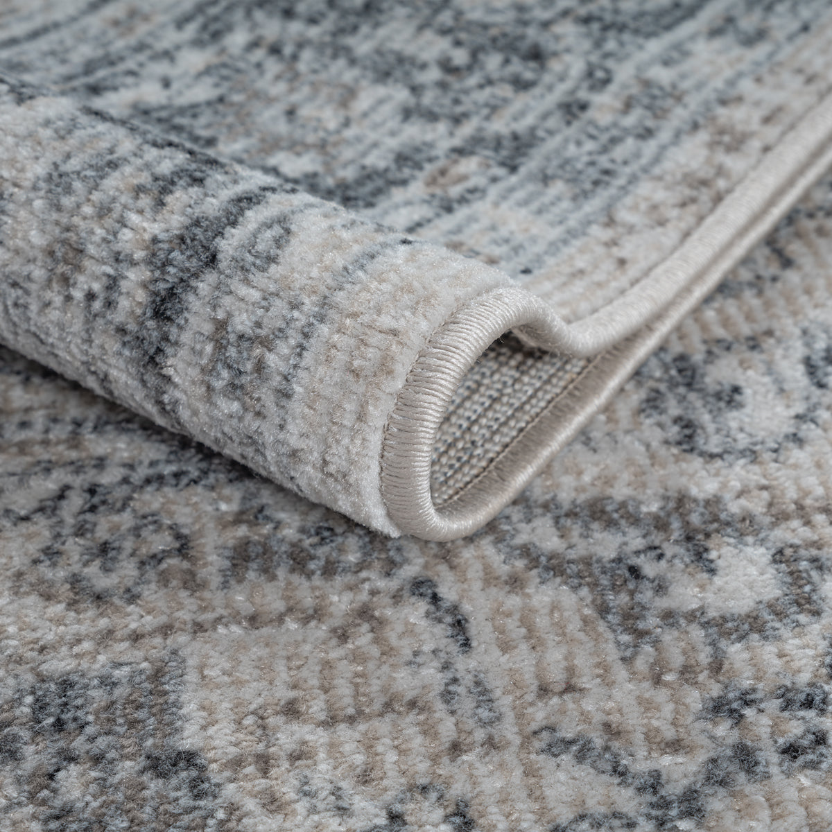 Vloerkleed Salsa Beigegrijs – Compacte maten voor balkon en hal – detail van de pool en de rand