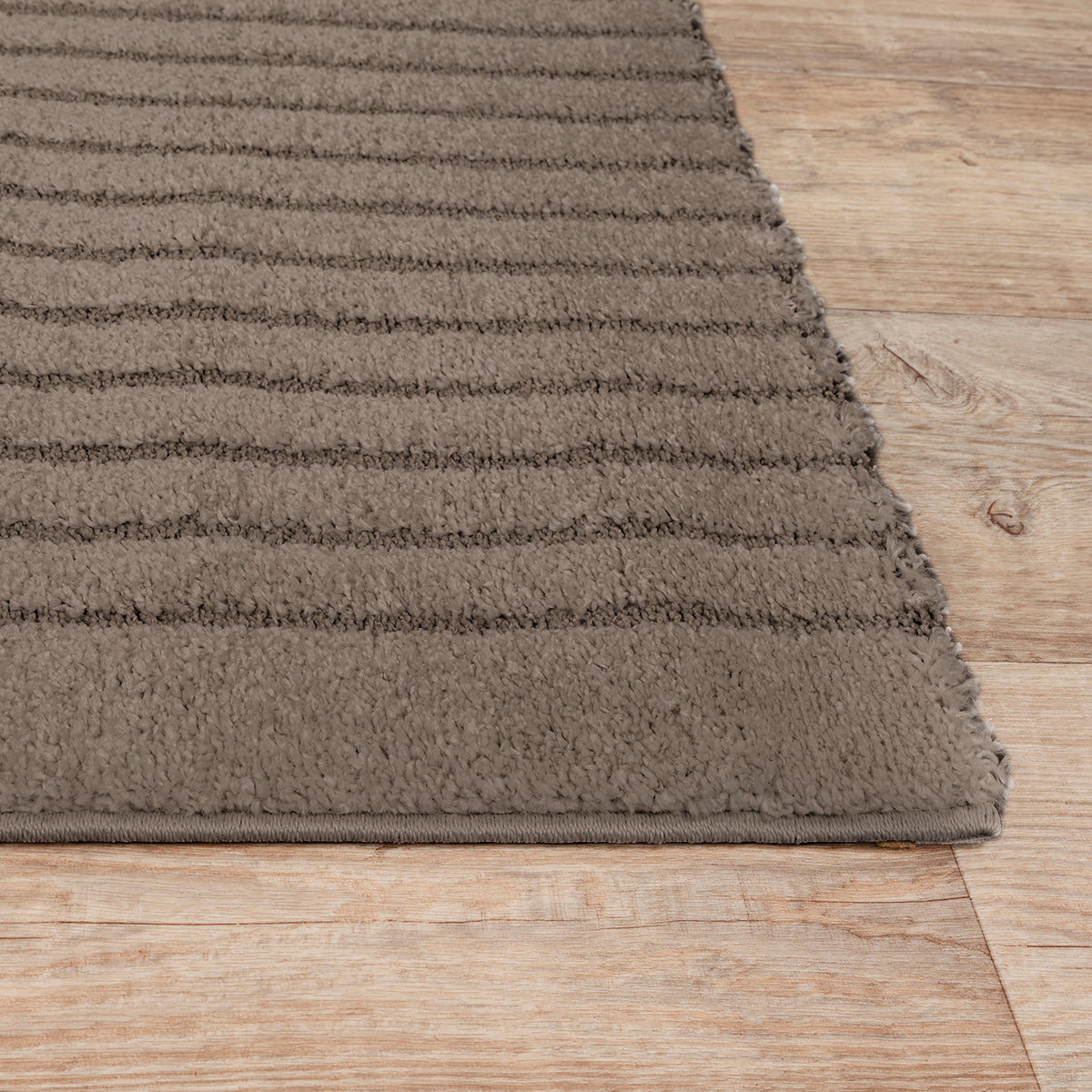 Vloerkleed Eclipse 2320 Bruin – Grafische cirkels op jute rug – sfeerimpressie in de woonkamer