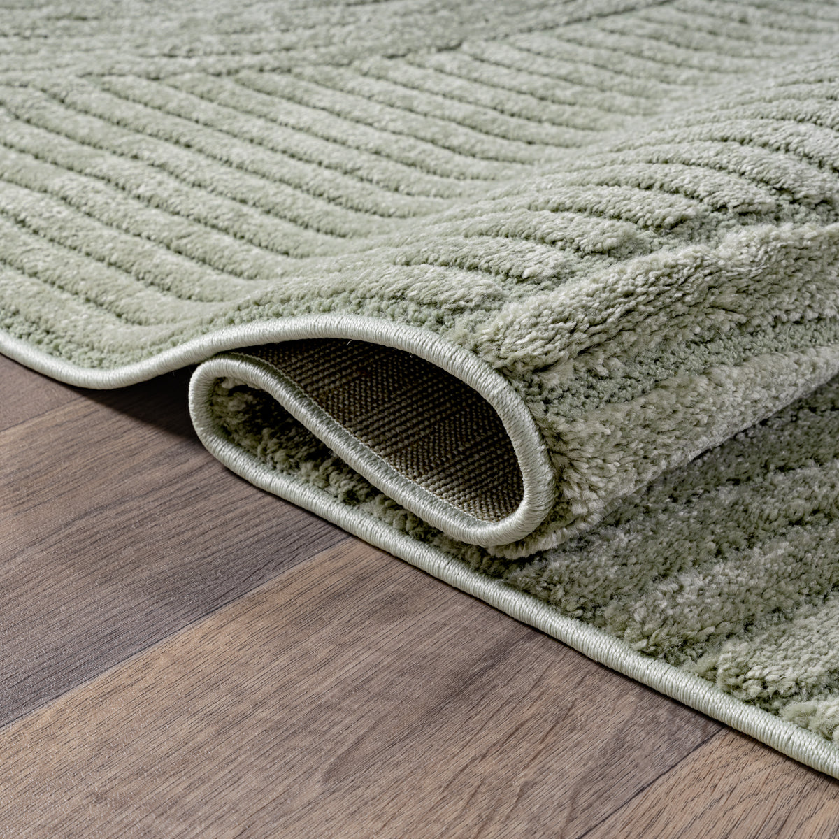 Vloerkleed Elio 2252 Groen – Zachte groentint op jute rug – detail van de weving in groen