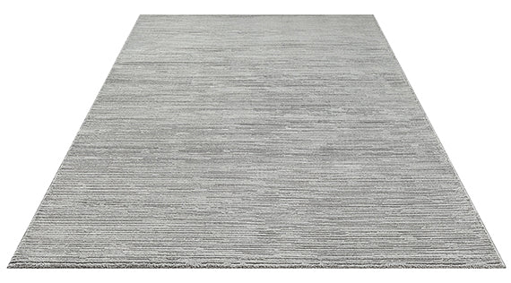 Vloerkleed Sign 1984 Grijs – Grafisch Reliëf in een Koele Grijstint – sfeerimpressie in de hal
