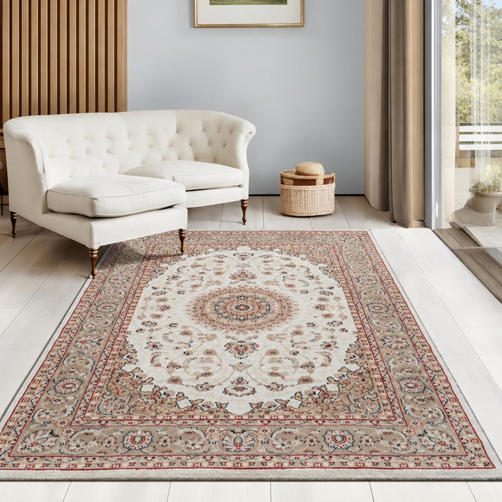 Vloerkleed Dubai Deluxe Beige en Crème met klassiek oosters medaillon voor een witte capitonné bank – sfeerimpressie in de woonkamer