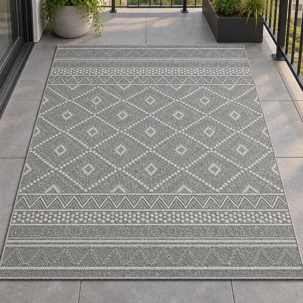 Vloerkleed Ottawa 22567 Grijs met wit ruitenpatroon en zigzagranden – sfeerimpressie op het balkon